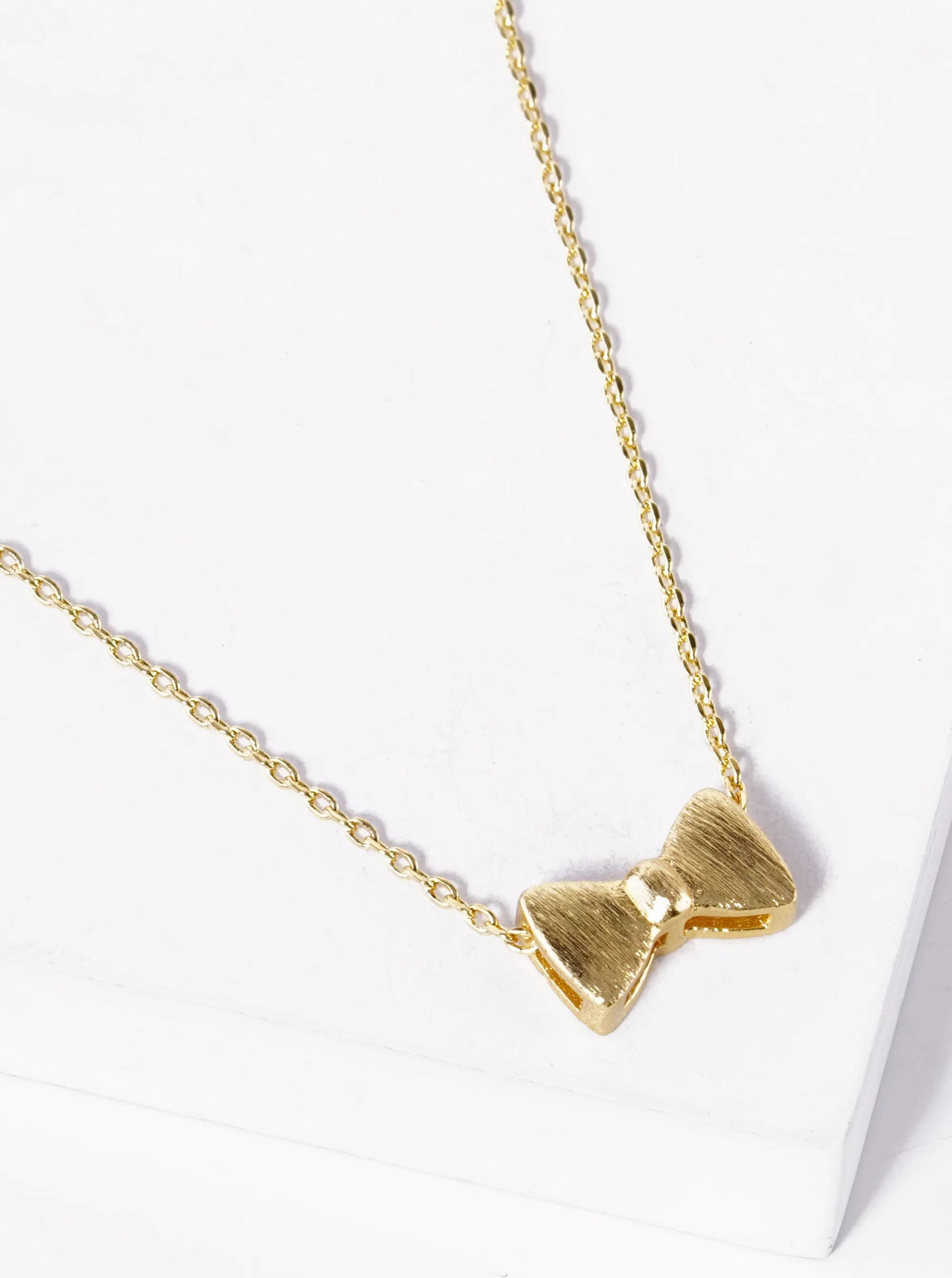 White Gold Dipped Brushed Metal Ribbon Bow Pendant Necklace