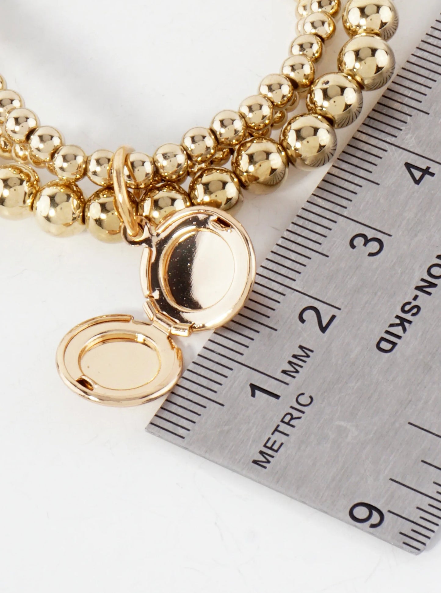 3-4-6mm Metallic-Beaded Stackable Stretch Bracelet With A Locket Charm