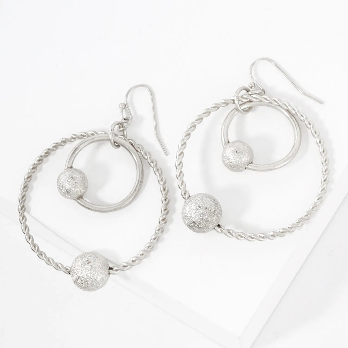 Double Circle Dangle Earrings With Sand-Texture Ball Accent