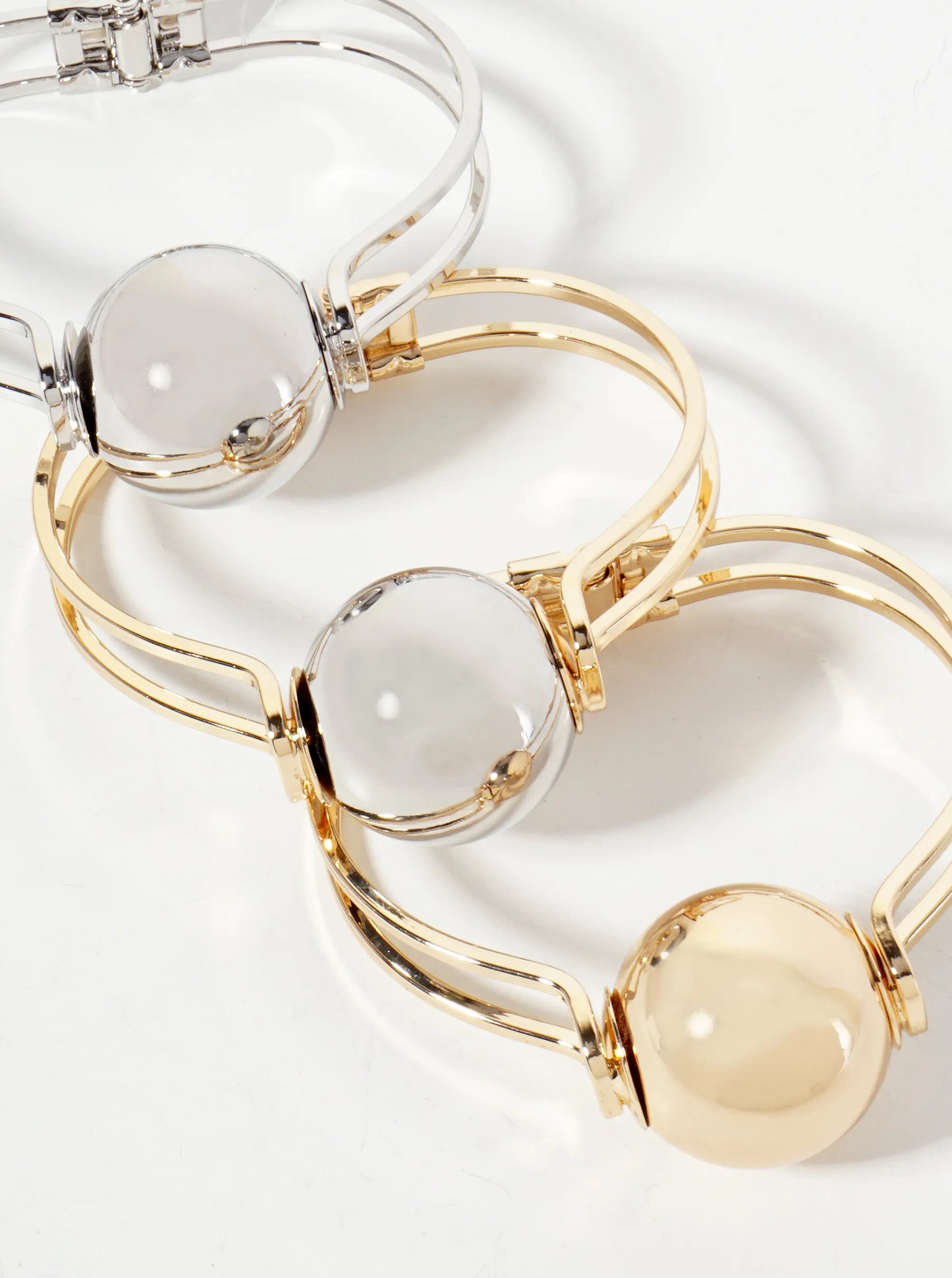 Polished Metal 1-inch Hollow Ball Accent Spring Hinged Bangle Bracelet