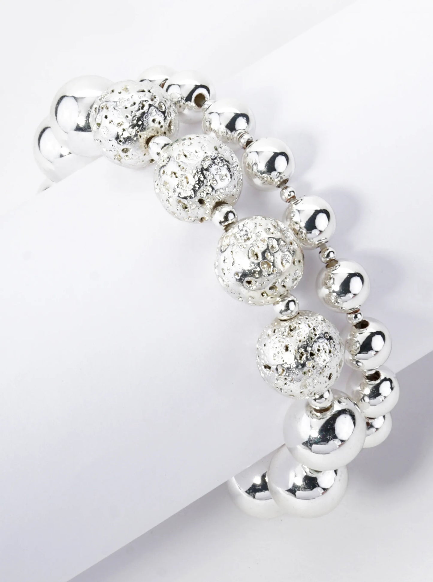 Set Of 2 Metallic Simulated Lava Stone Stackable Stretch Bracelet