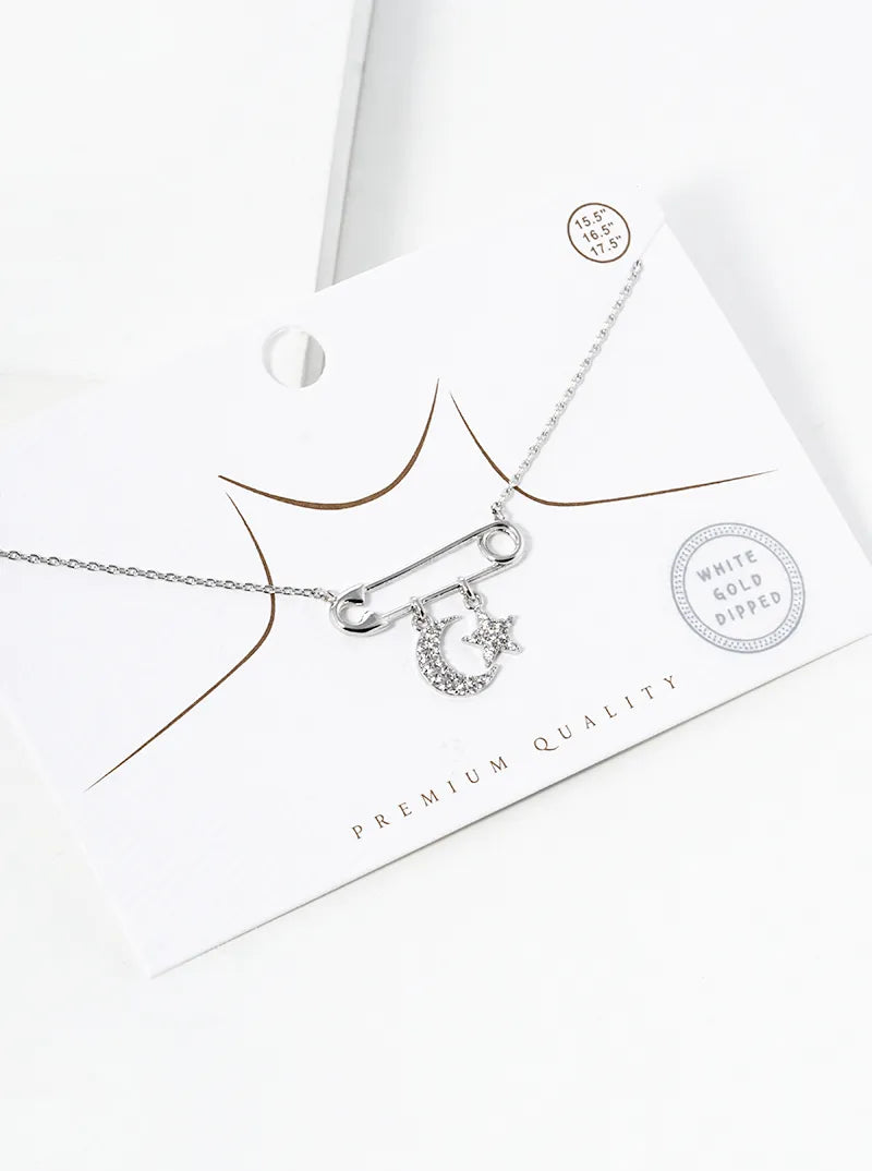 White Gold Dipped Safety Pin With Star And Moon Drop Pendant Necklace