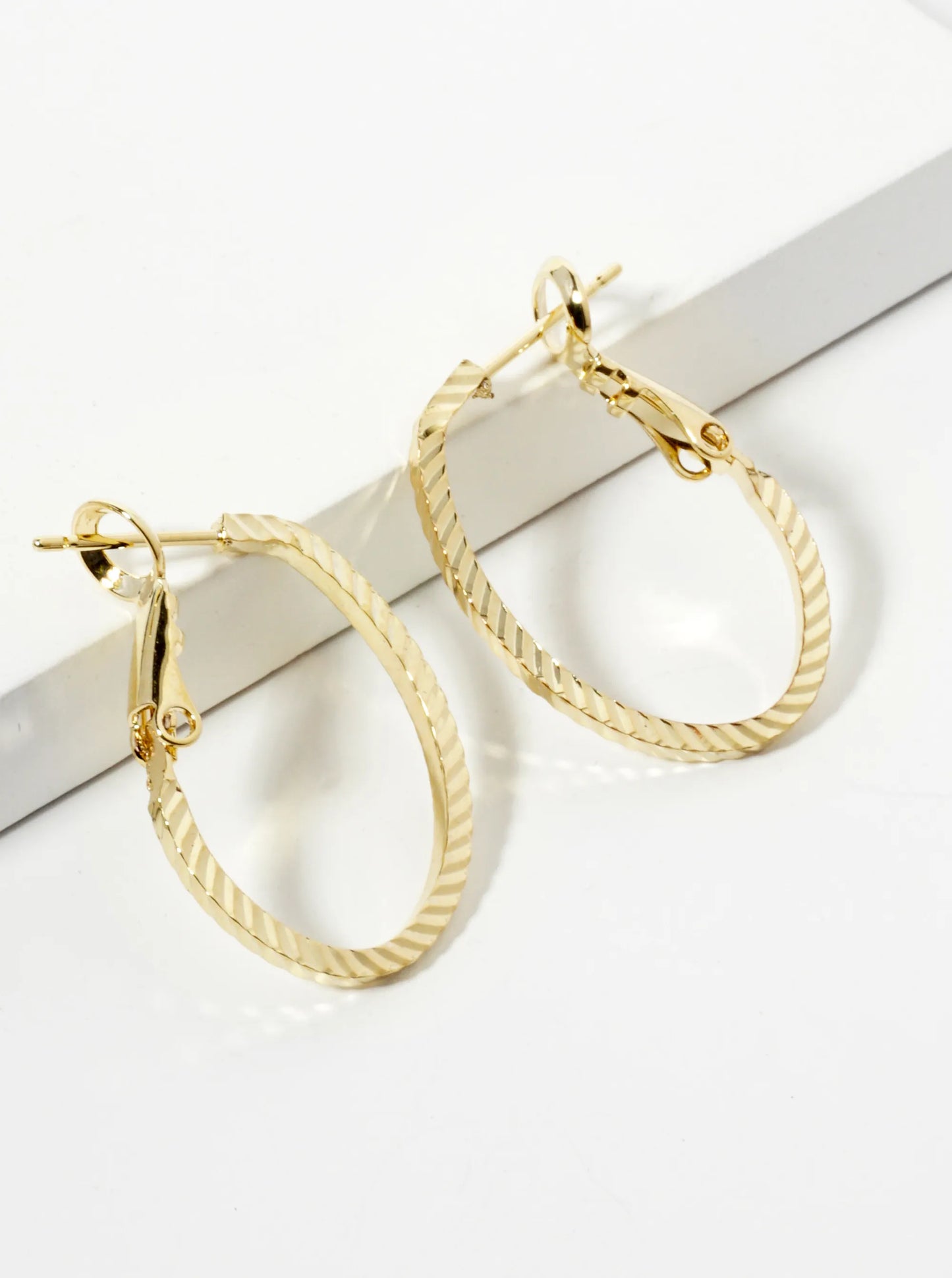 23mm 14K-Gold-Dipped Diagonal-Texture Oval Latch-Back Hoop Earrings