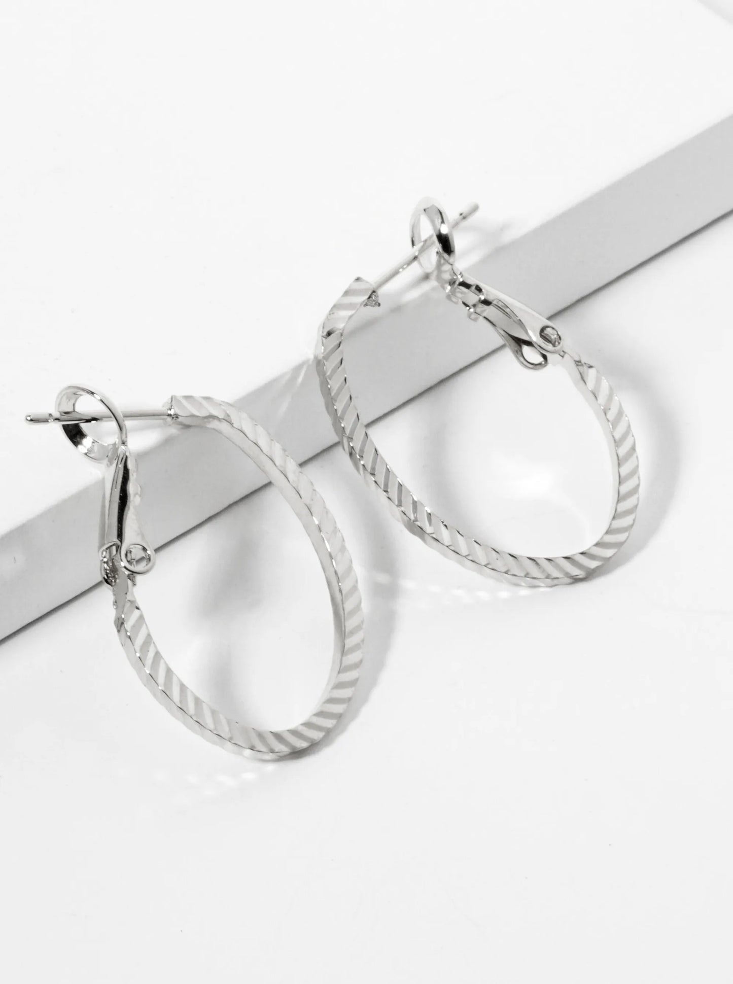 23mm 14K-Gold-Dipped Diagonal-Texture Oval Latch-Back Hoop Earrings