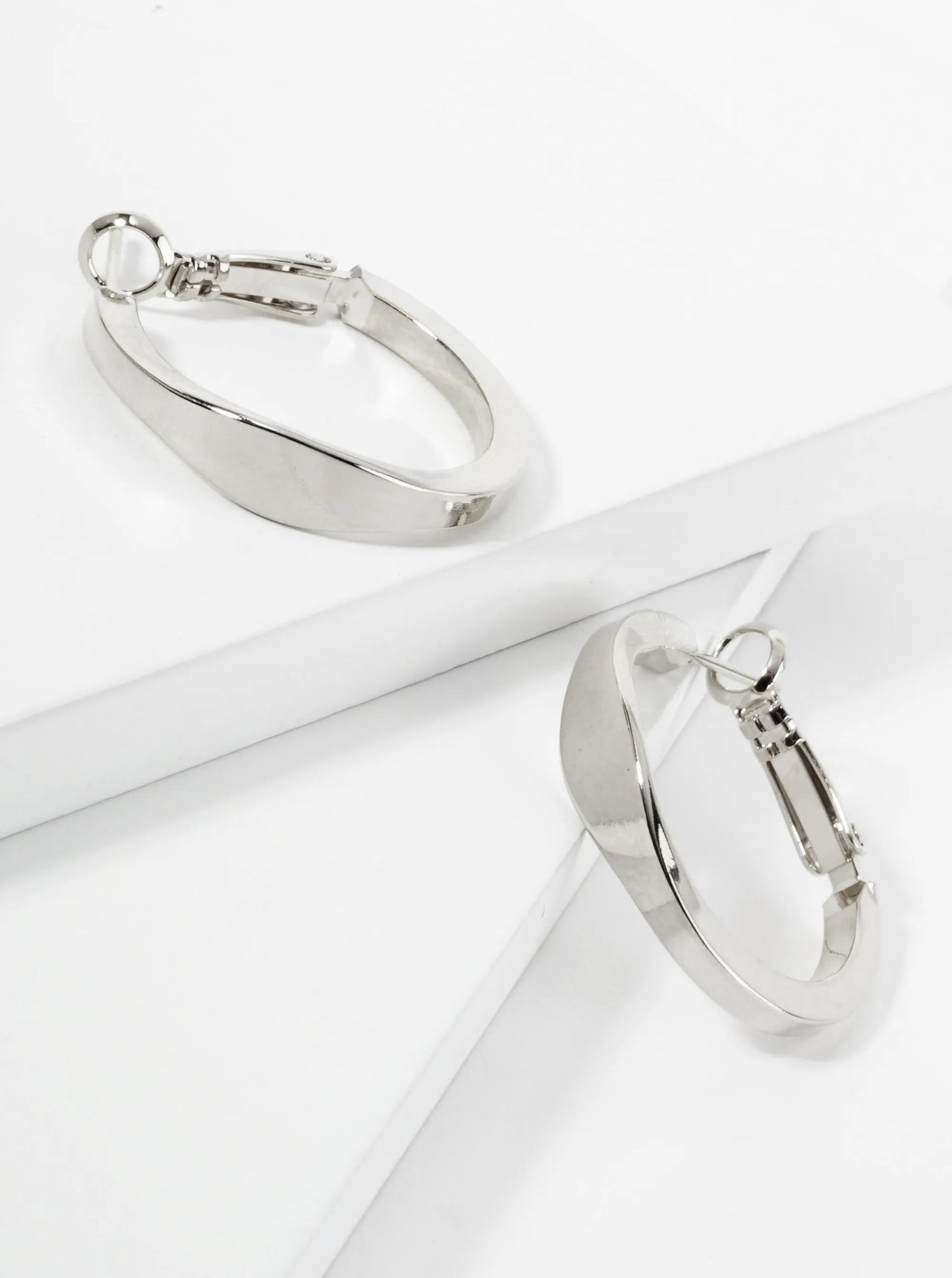 25mm Polished Metal Latch Back Hoop Earrings With Compressed Center