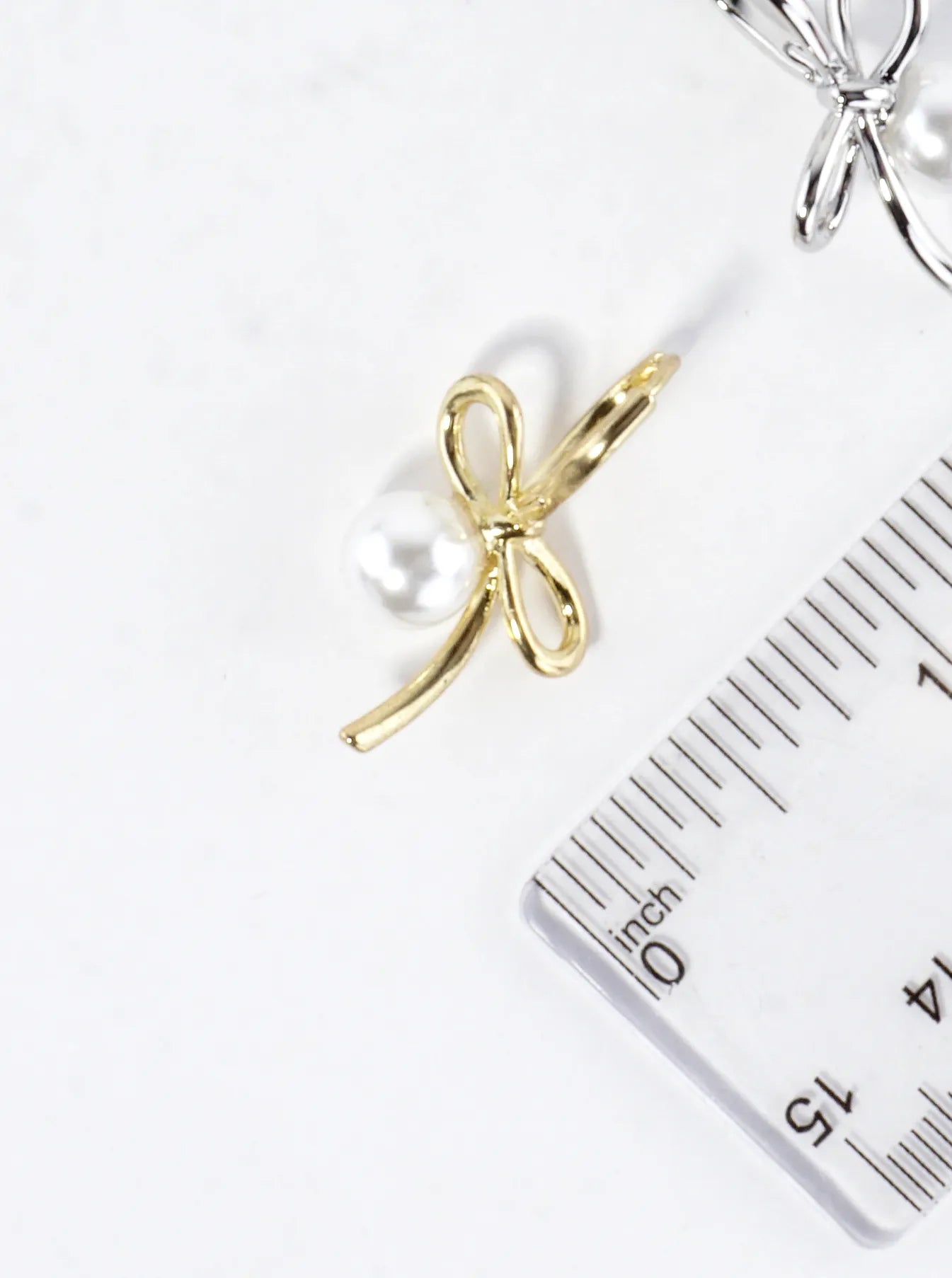 Brass Bow On Pearl Pedestal Drop Earrings