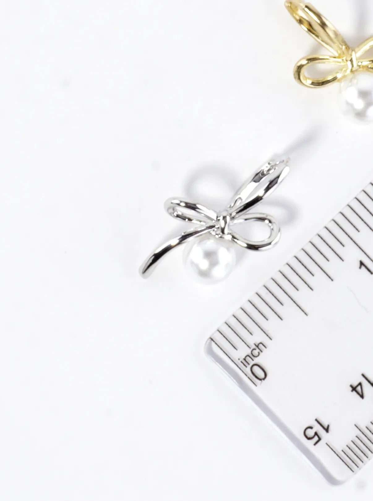 Brass Bow On Pearl Pedestal Drop Earrings