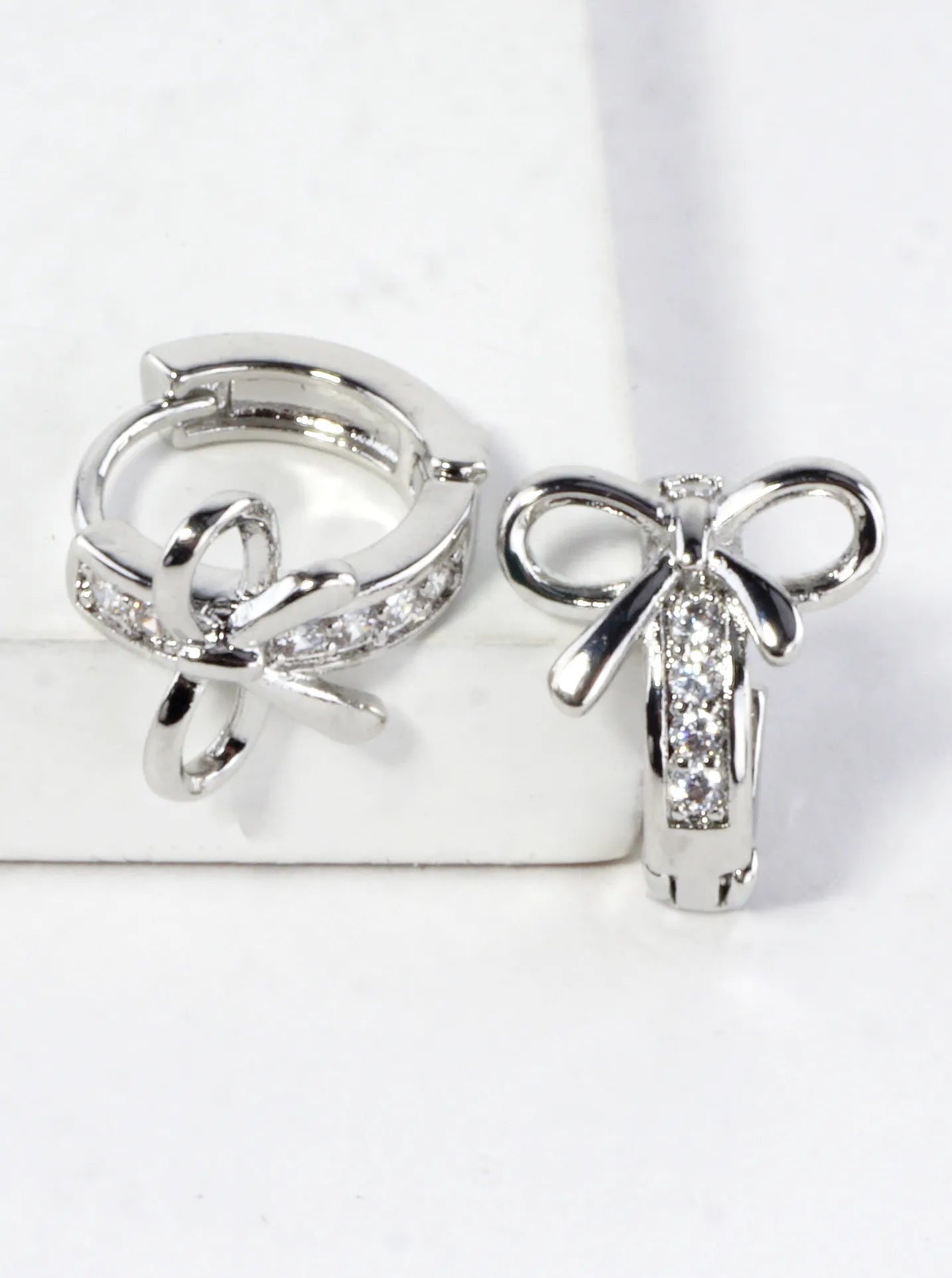 CZ Pave Polished Ribbon Bow Huggie Hoop Earrings