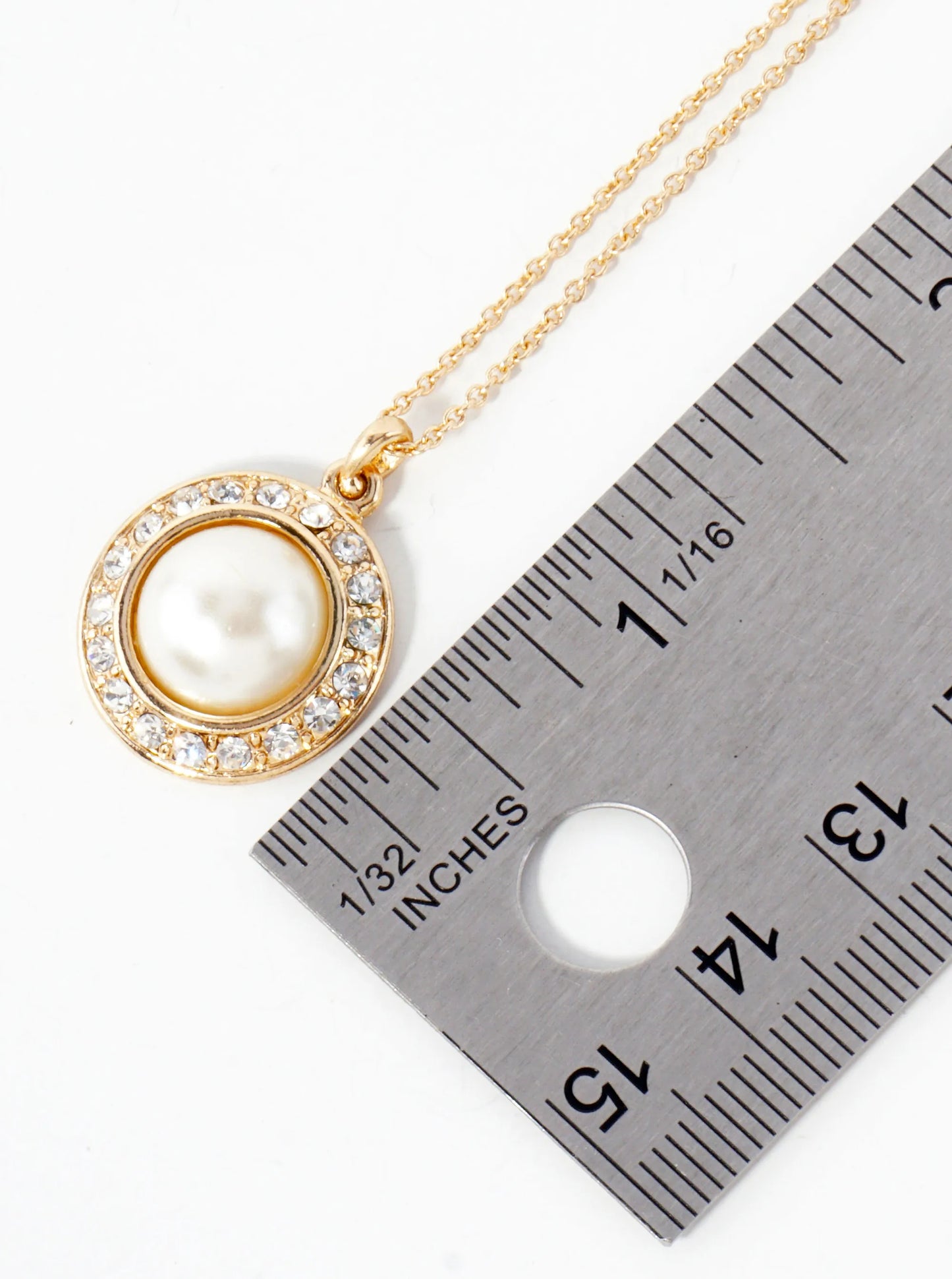 Crystal-Studded Border Highlighting A Central Pearl Pendant Necklace