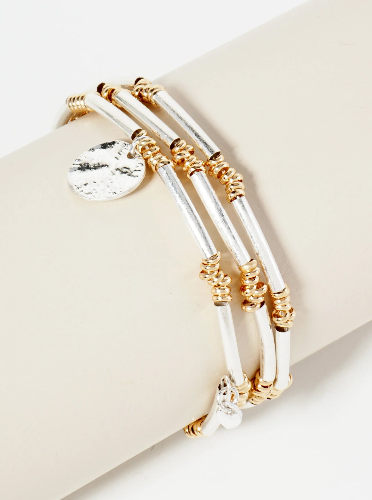 Dual-Tone Elastic Spring Bracelet With Hammered Disc Charm