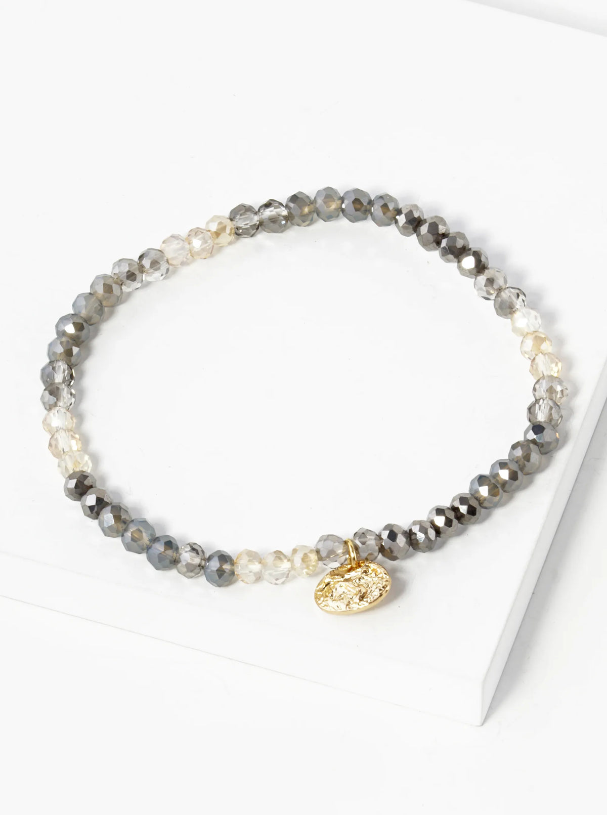 Faceted Glass Beaded Ombre Stretch Bracelet With Oval Metal Charm