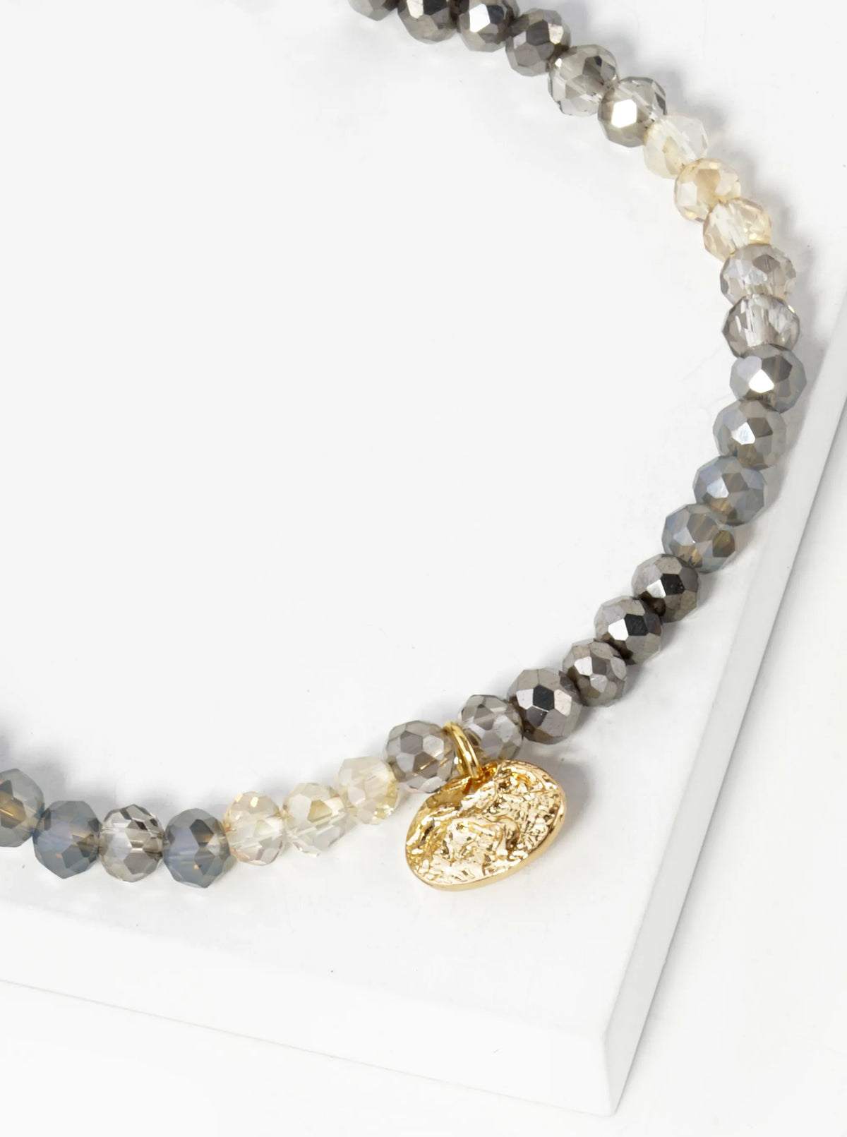Faceted Glass Beaded Ombre Stretch Bracelet With Oval Metal Charm