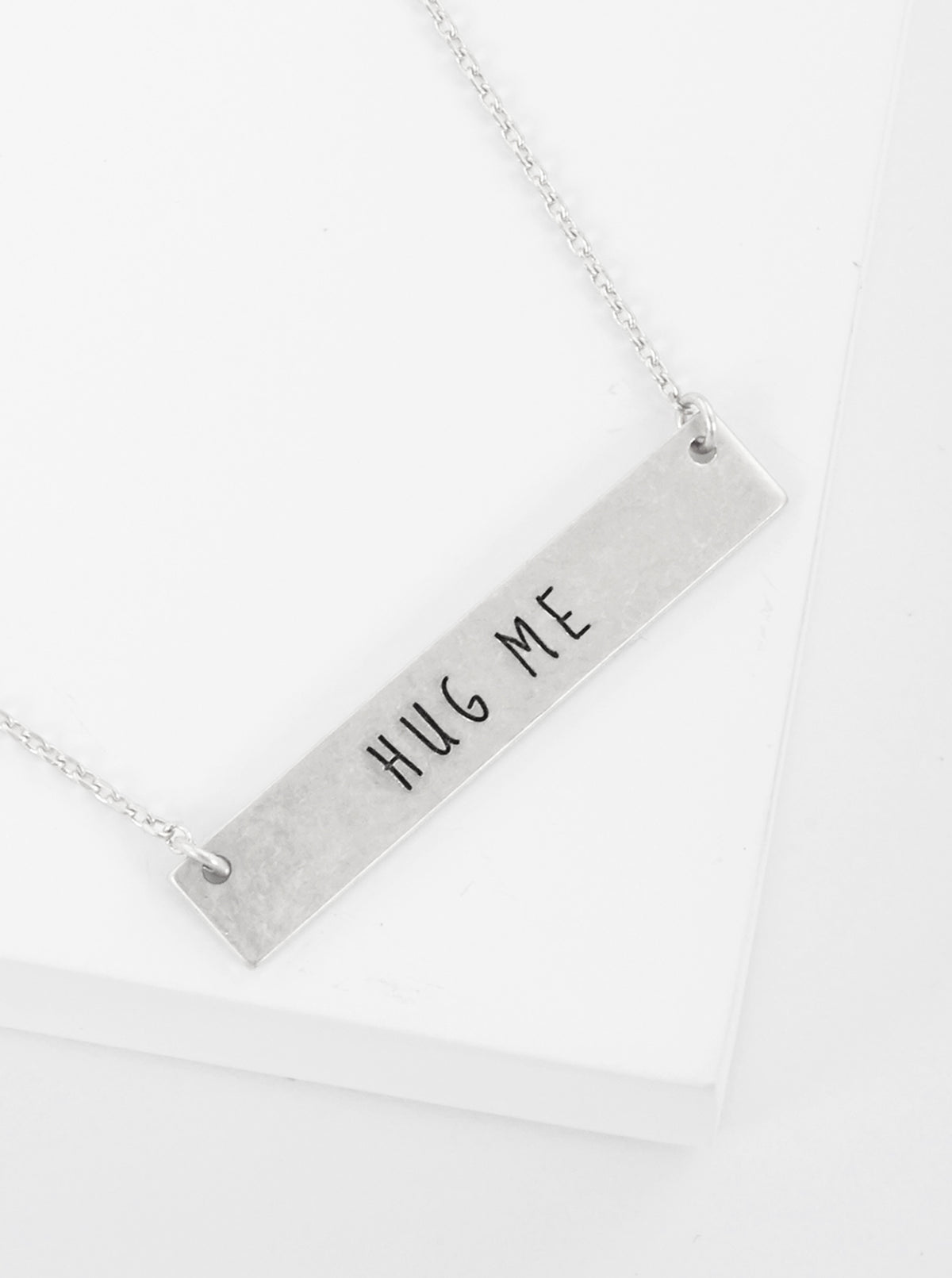 Hug Me Engraved Horizontal Bar Pendant Necklace