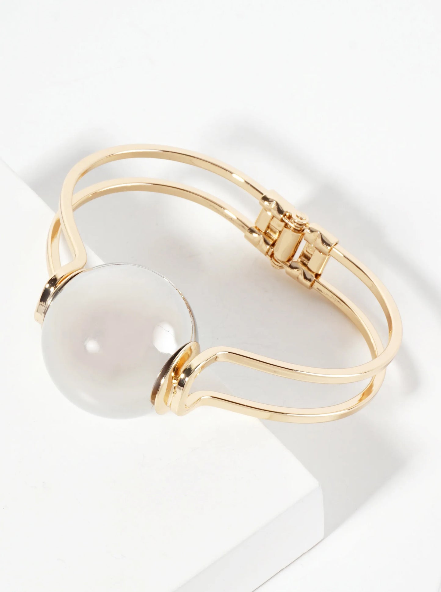 Polished Metal 1-inch Hollow Ball Accent Spring Hinged Bangle Bracelet
