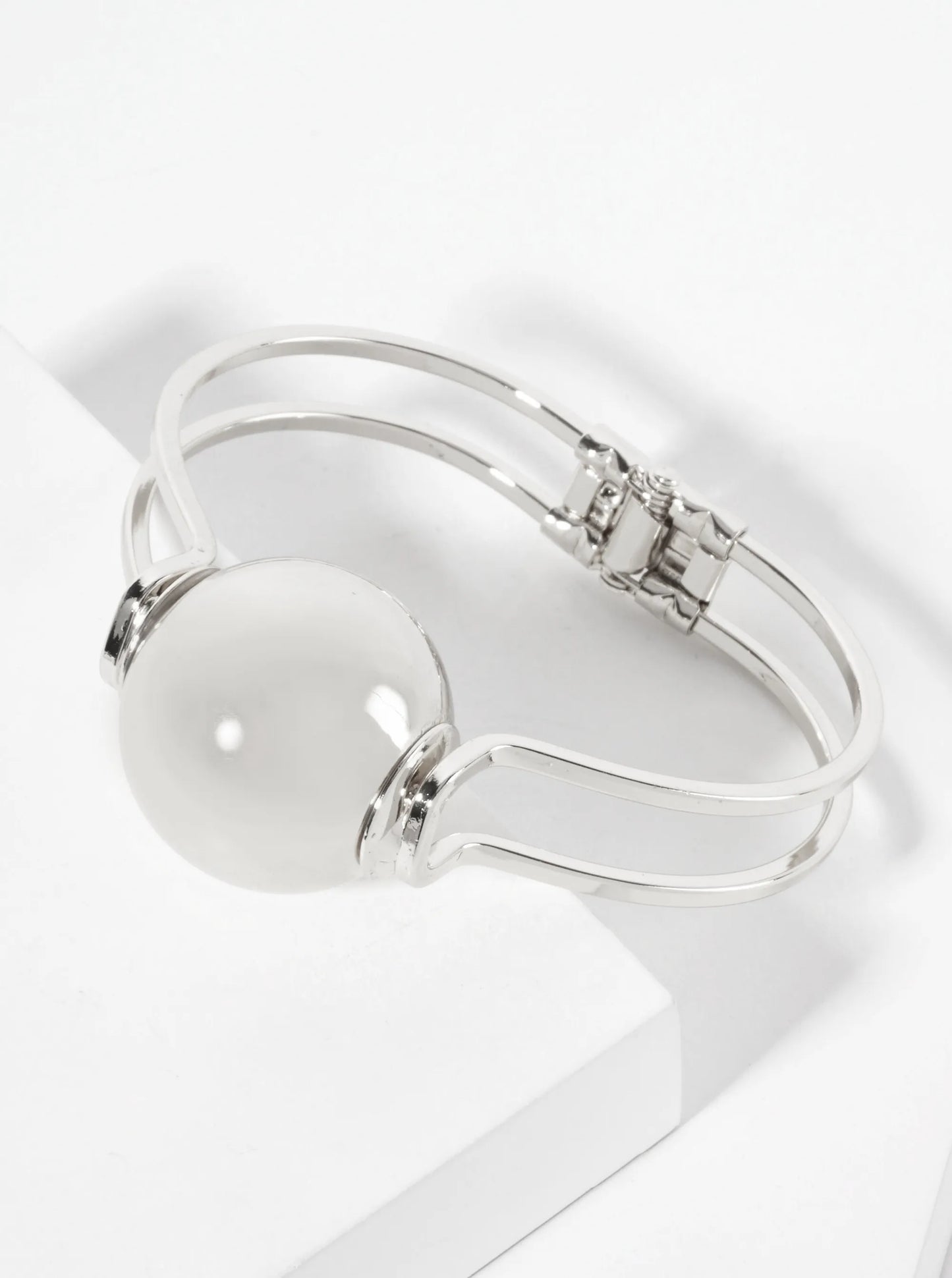 Polished Metal 1-inch Hollow Ball Accent Spring Hinged Bangle Bracelet