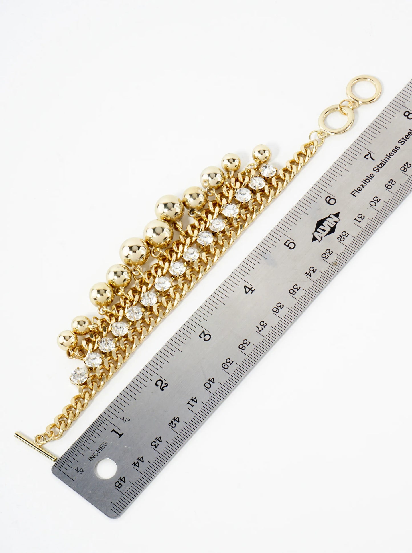 Polished Metal Toggle Bracelet With 4-Prong Rhinestone Accents Graduated Metallic Ball Charms