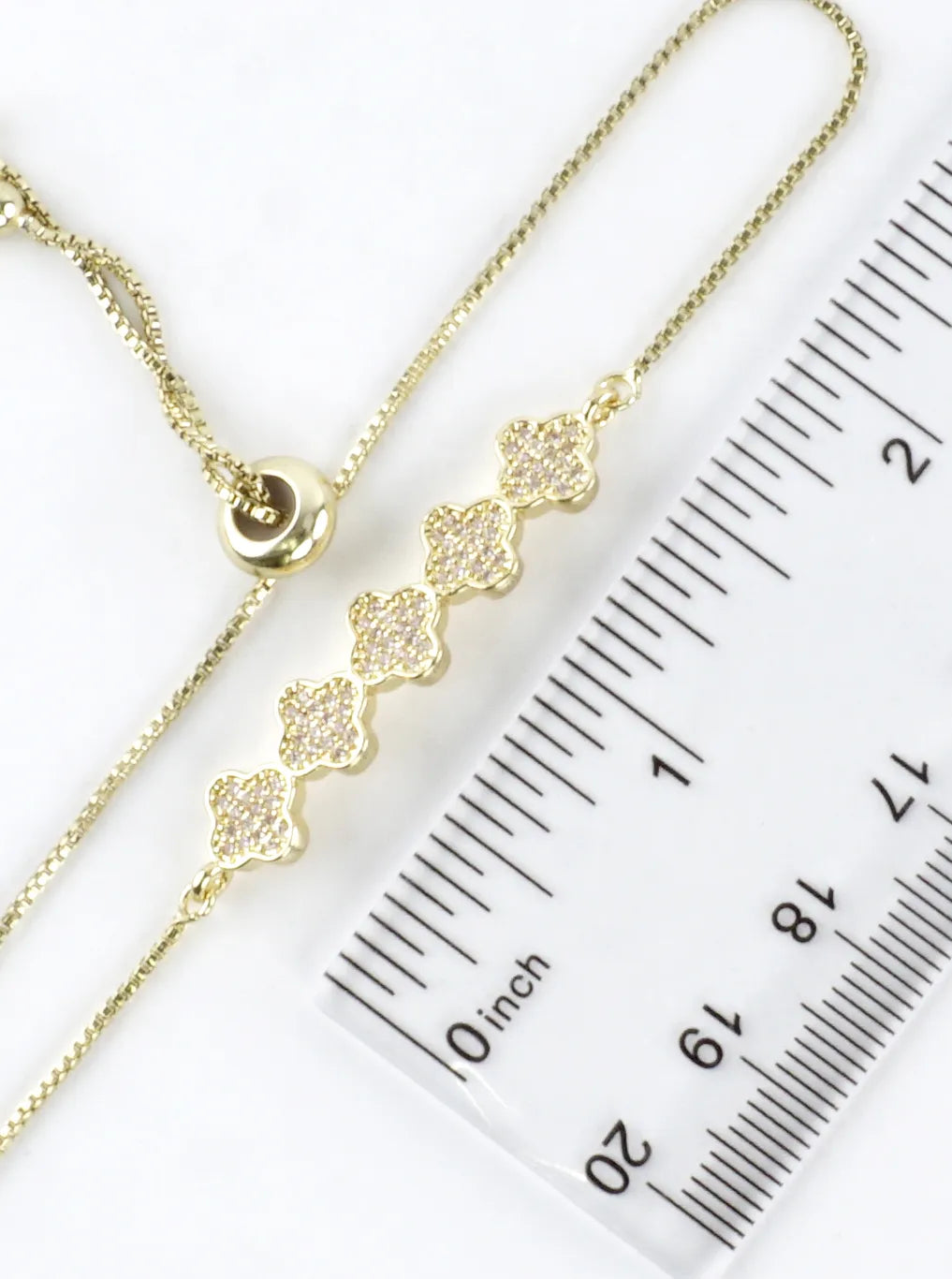 Quatrefoil CZ Pave Brass Pull Tie Bracelet