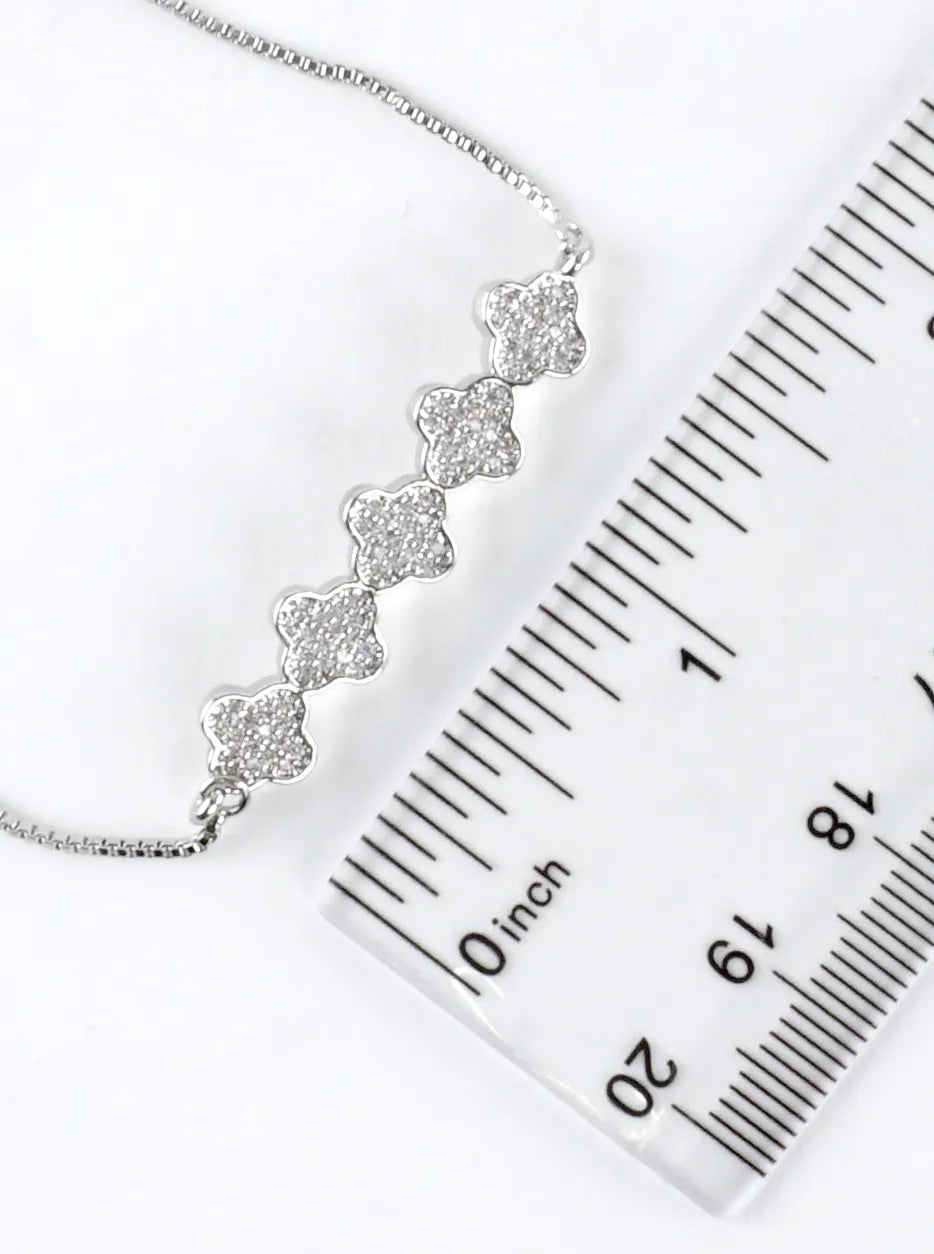 Quatrefoil CZ Pave Brass Pull Tie Bracelet