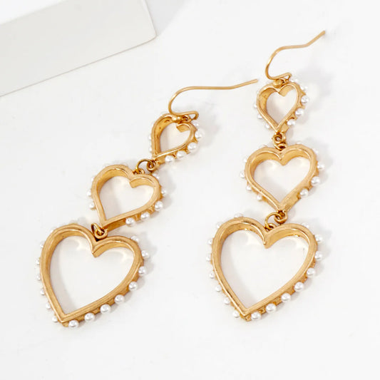 Three Graduated Heart Drop Earrings With Pearl-Trimmed Edges