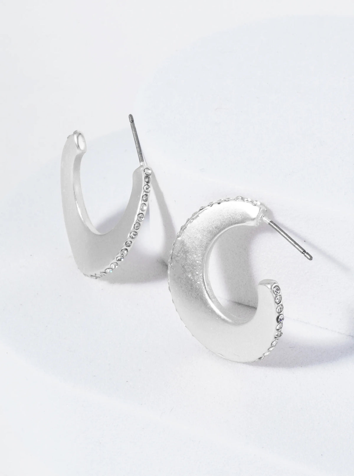 Wavy Hoop Earrings Embellished With Closely Set Stones