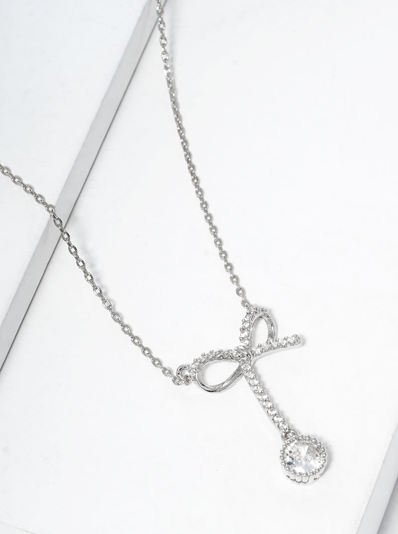 White Gold Dipped CZ Pave Ribbon Bow With Star Drop Pendant Necklace